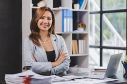 Smiling Asian businesswoman working on laptop in modern office Accountant Concept Finance Expert Analyze Business Report Graph financial chart financial chart corporate economy Banking Market Research