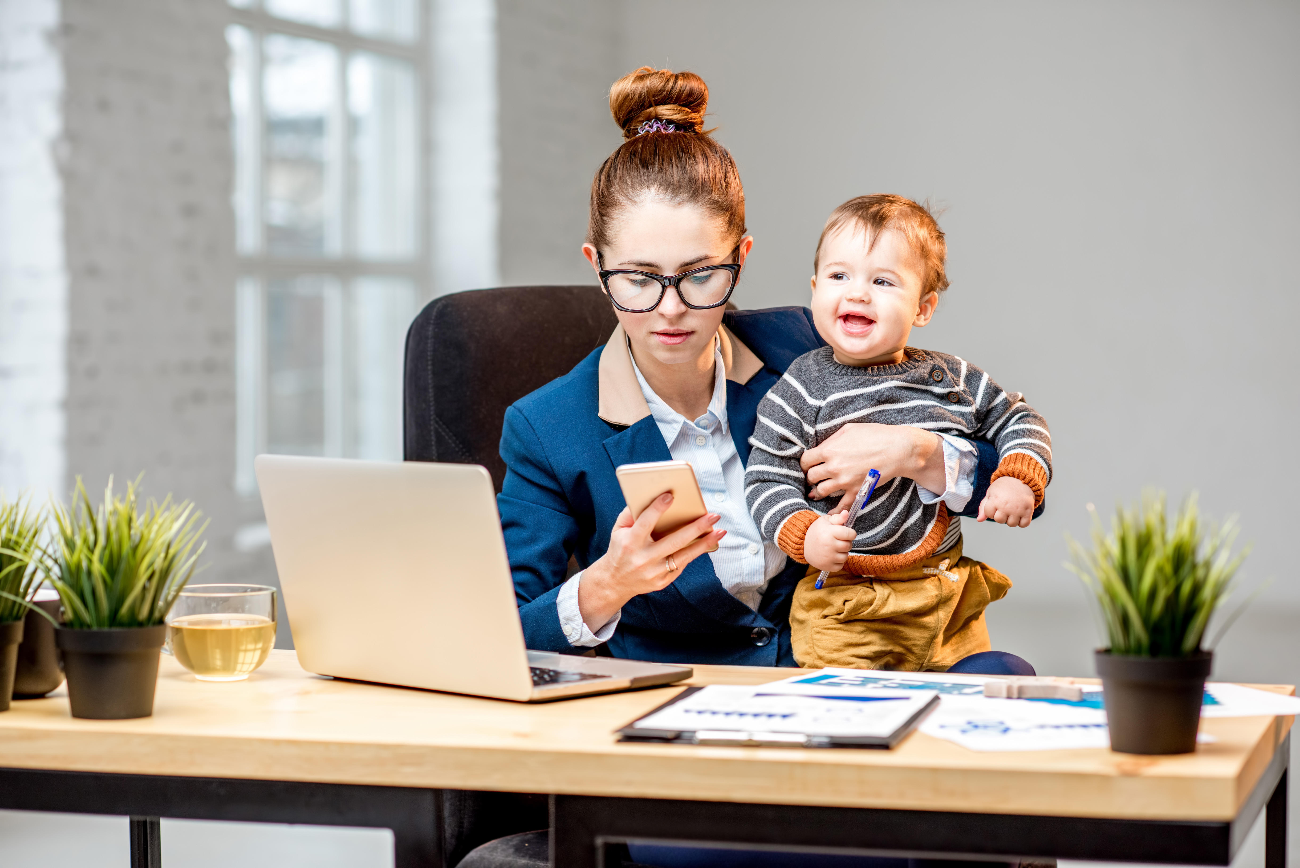 Mother at work with child