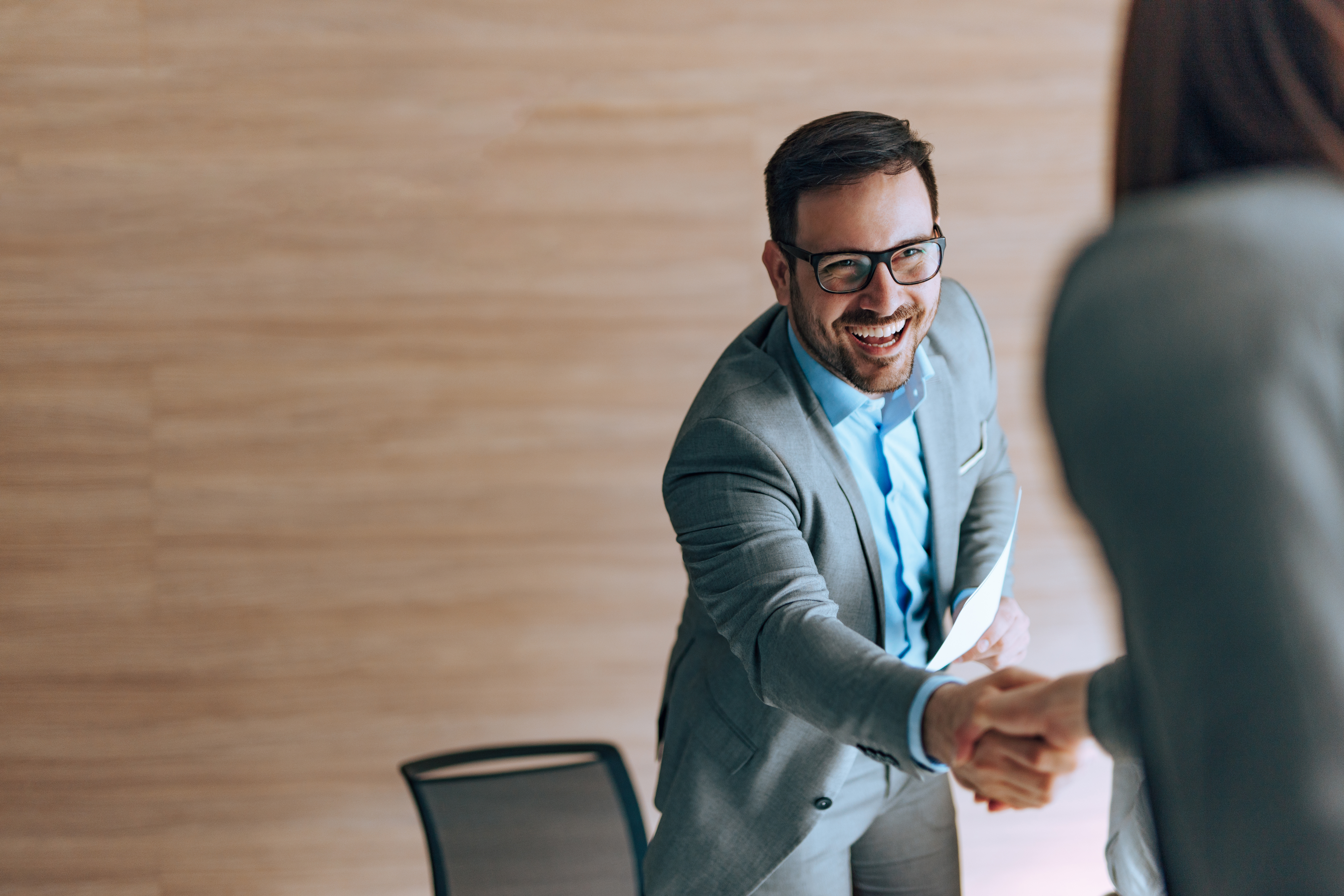 Manager handshake with job applicant, portrait, copy space.