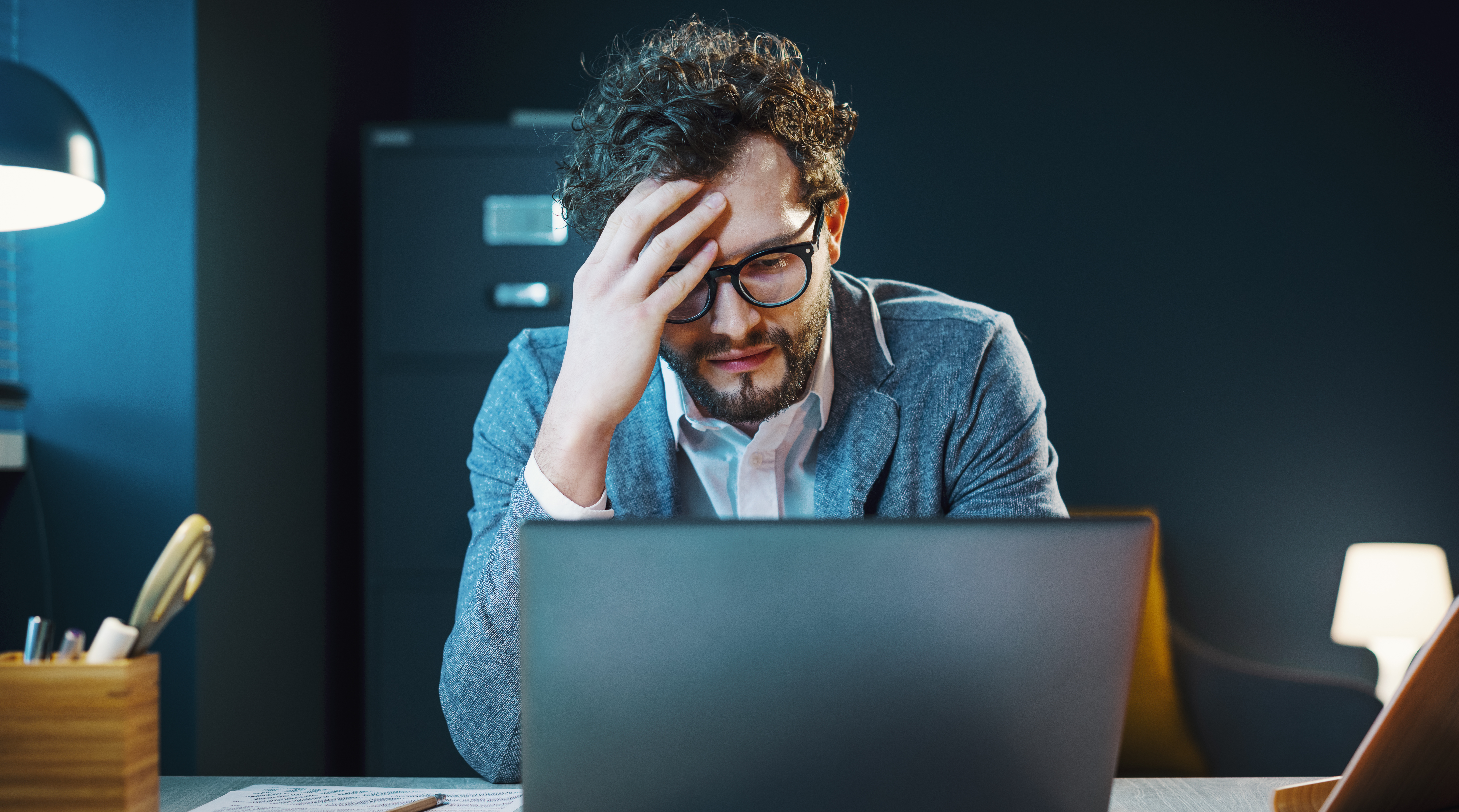 Stressed businessman working in the office